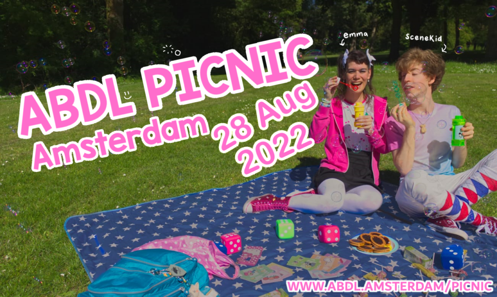 Emma and Scenekid on a picnic blanket